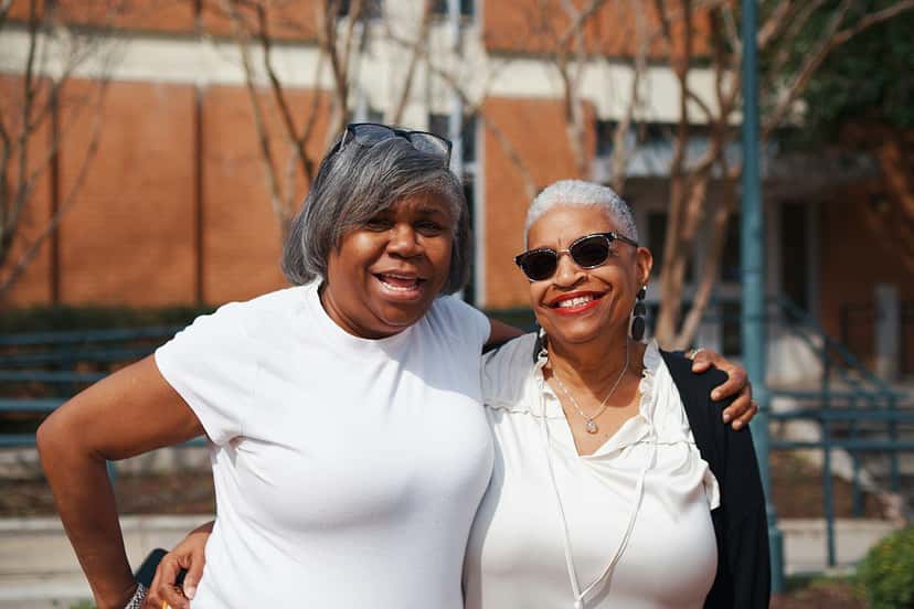Two women smiling together outdoors